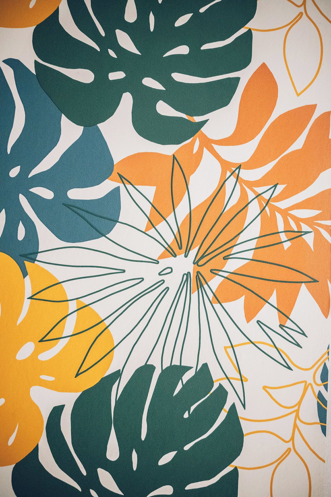 A wall with a tropical leaf pattern.