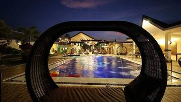 Outdoor pool, open 10:00 AM to 10:00 PM, pool loungers