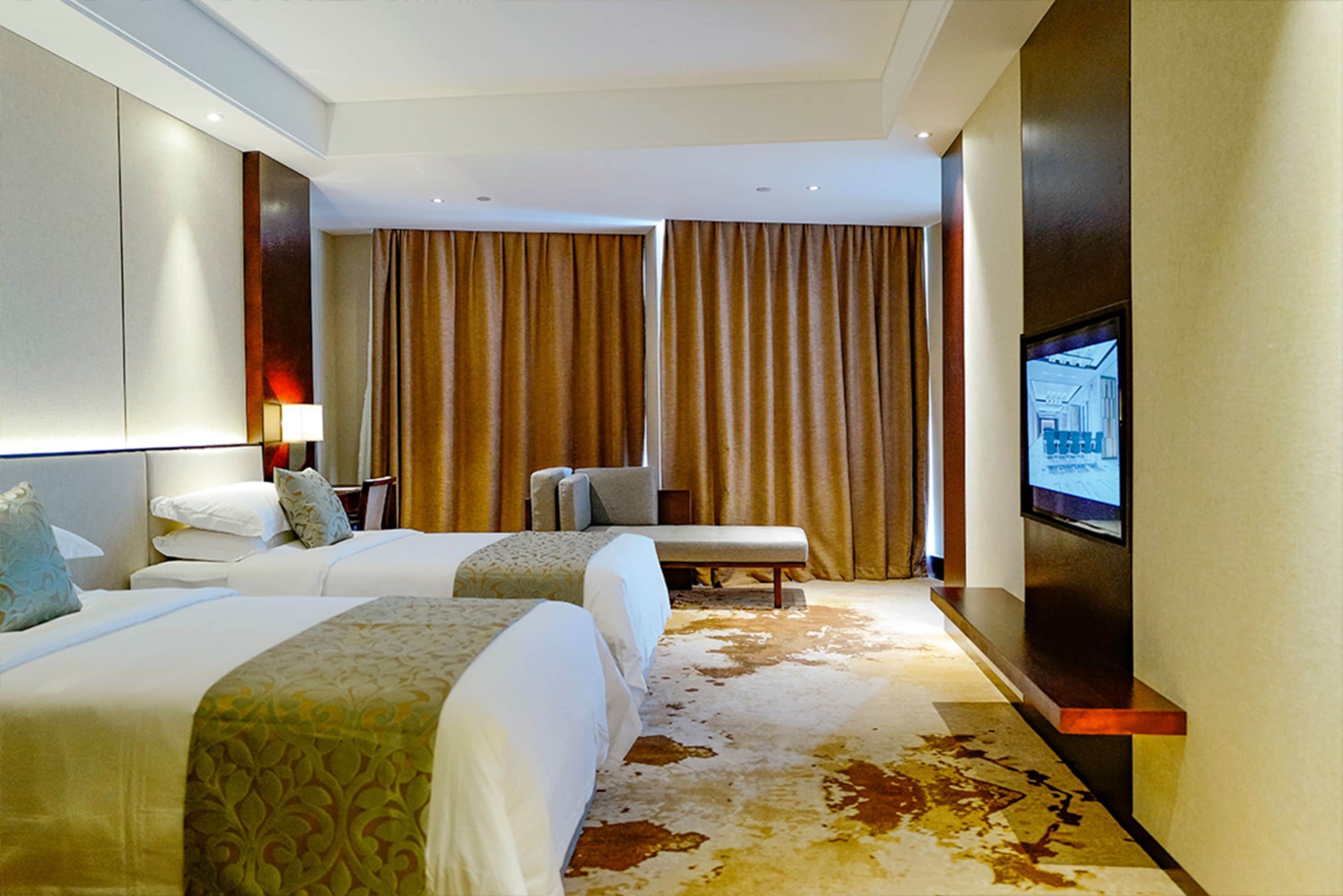 deluxe twin room | down duvets, in-room safe, desk, blackout curtains