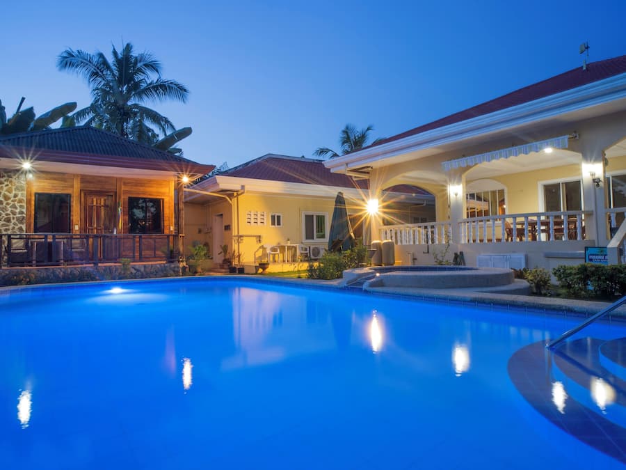 Outdoor pool, open 11:00 AM to 7:00 PM, pool loungers