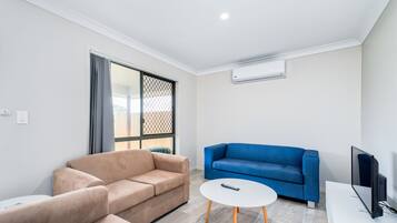 Deluxe Townhome, 3 Bedrooms | Living room | LED TV