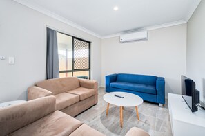 Deluxe Townhome, 3 Bedrooms | Living room | LED TV - Convenient 3 Bedroom House with Parking (Morayfield)