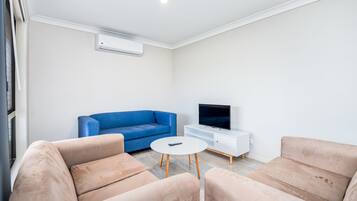 Deluxe Townhome, 3 Bedrooms | Living room | LED TV