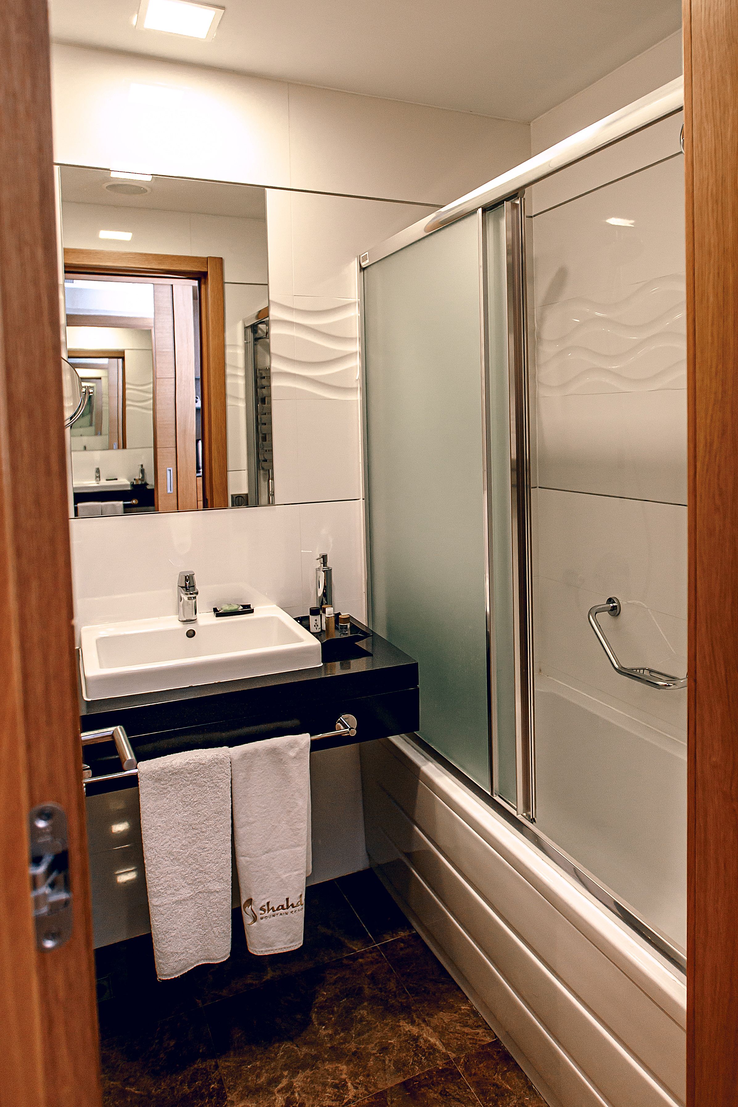 superior twin room | bathroom | shower, free toiletries, hair dryer, slippers