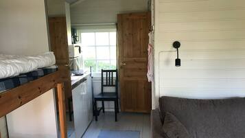 Basic Cabin, Lake View (Humsjöstugan) | Living room | Flat-screen TV