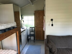 Basic Cabin, Lake View (Humsjöstugan) | Living room | Flat-screen TV - Sandvikengården Stugby (Brunskog)