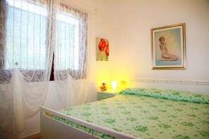 Apartment, 2 Bedrooms, Ground Floor | 2 bedrooms, individually decorated, individually furnished - Tanaunella Happy Sardinia (Budoni)