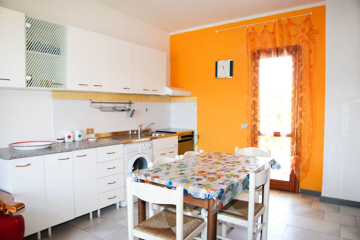 Apartamento, 2 quartos | Cozinha privada | Máquina de café expresso, geladeira grande, cooktop