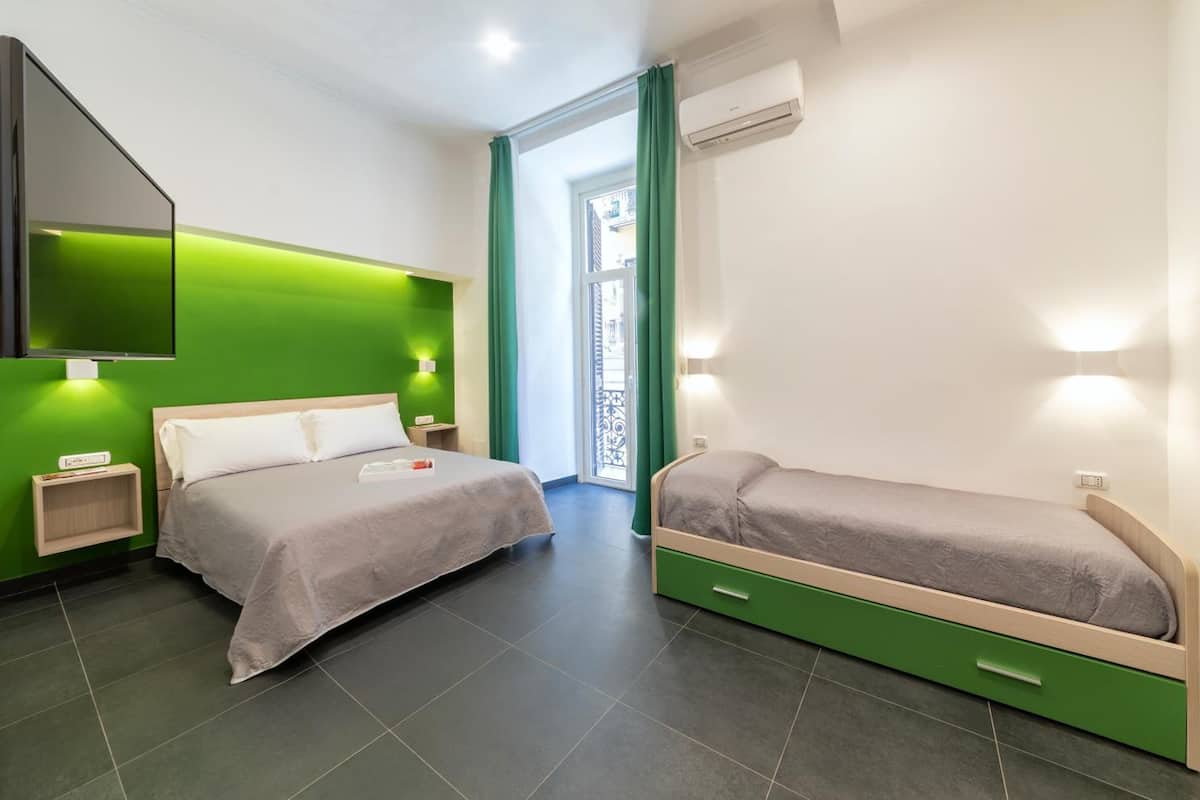Deluxe Quadruple Room, Multiple Beds, Non Smoking, Ensuite | Minibar, in-room safe, desk, laptop workspace