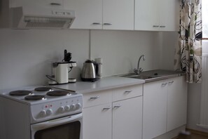 Fridge, microwave, stovetop, coffee/tea maker