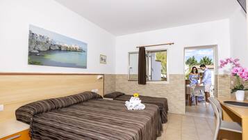 Comfort Triple Room, Garden View | In-room safe, desk, blackout curtains, free WiFi