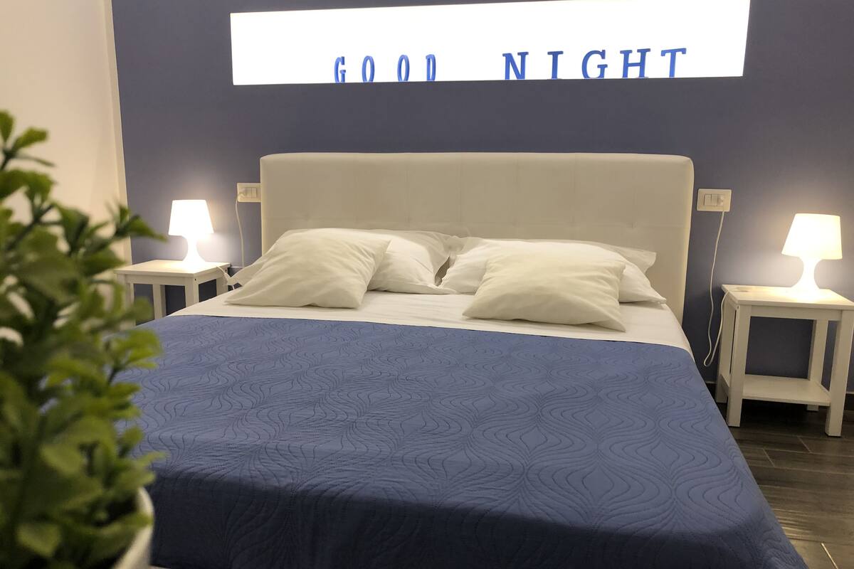 Deluxe Quadruple Room (Vesuvio view) | Premium bedding, minibar, desk, blackout drapes