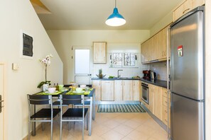 Villa, 2 Bedrooms | Private kitchen | Full-size fridge, oven, stovetop, coffee/tea maker