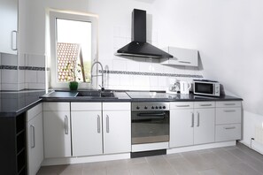 Apartment, 2 Bedrooms | Private kitchen | Coffee/tea maker, electric kettle