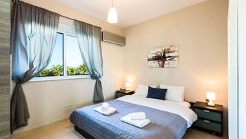 Deluxe Apartment, 2 Bedrooms, Pool View | 2 bedrooms, individually decorated, individually furnished