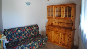 Apartment, 1 Bedroom | Living area - Bilocali Zenzero porto istana (Olbia)