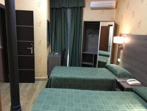 Triple Room | Minibar, in-room safe, free cots/infant beds, free WiFi
