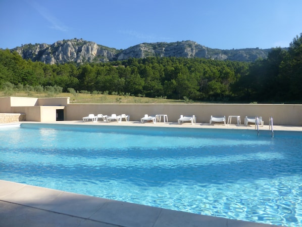 Seasonal outdoor pool, pool umbrellas, pool loungers