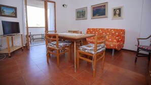 Apartment, 3 Bedrooms | Living area - Quadrilocale San Teodoro con Terrazza (San Teodoro)