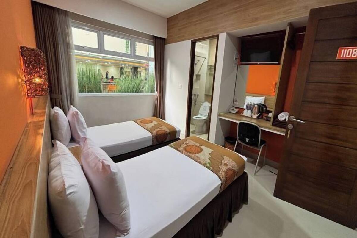 Premium bedding, desk, laptop workspace, blackout curtains
