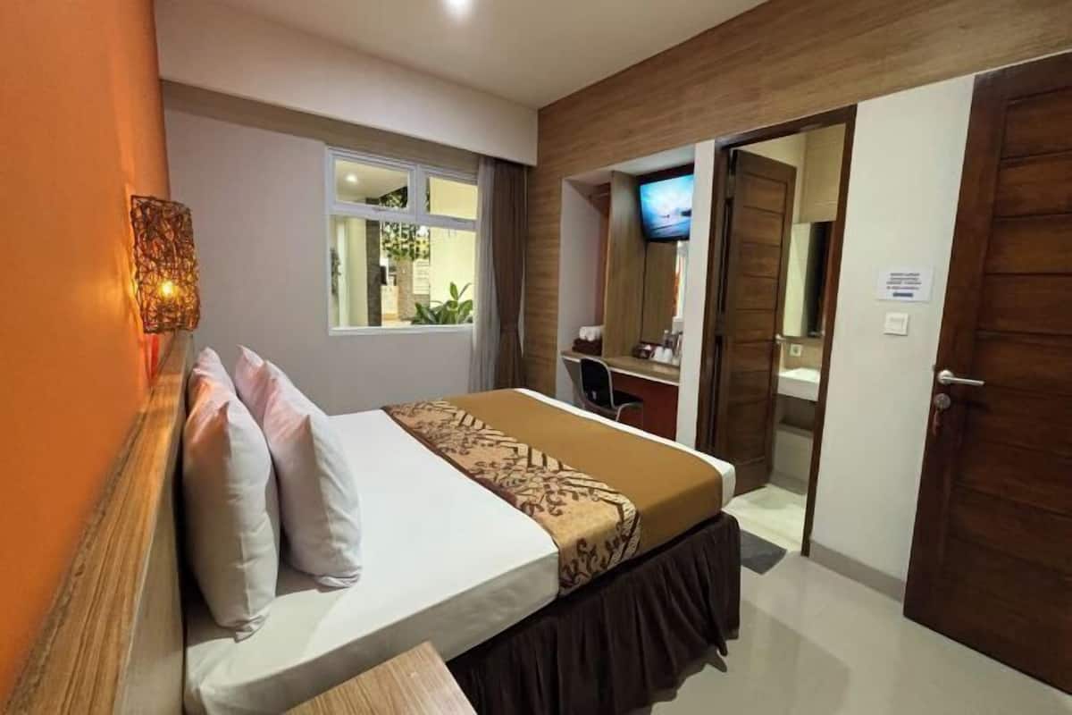 Premium bedding, desk, laptop workspace, blackout curtains