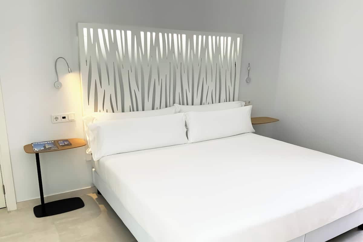 Apartment, 1 Bedroom, Pool View | 1 bedroom, down duvets, memory-foam beds, individually decorated