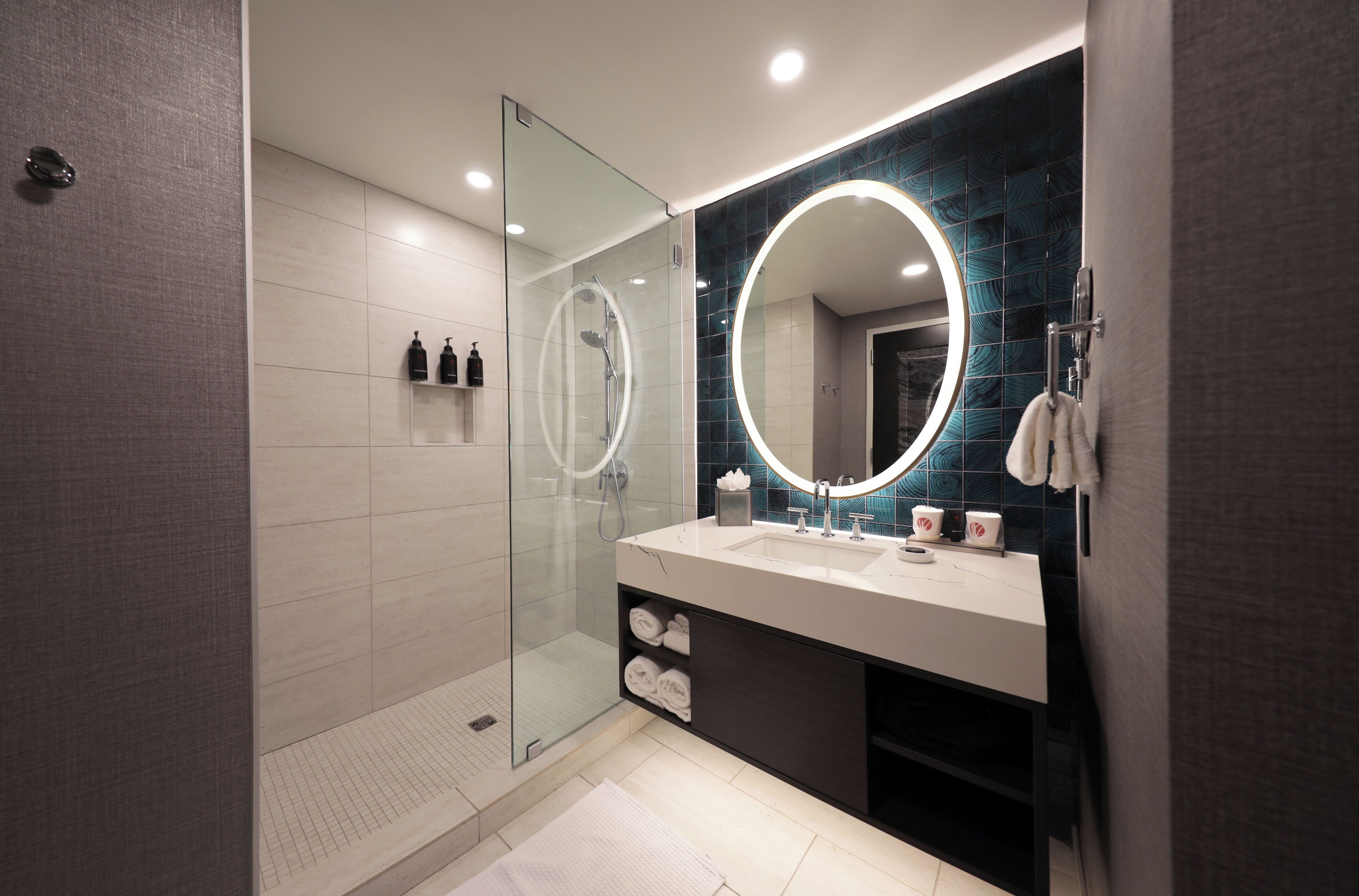 Designer toiletries, hair dryer, towels, soap