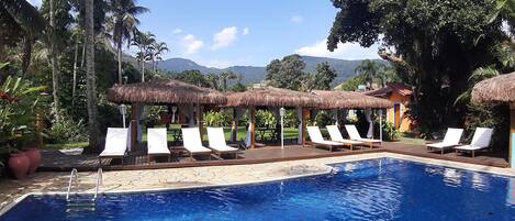 Outdoor pool, open 10:00 AM to 10:00 PM, pool loungers