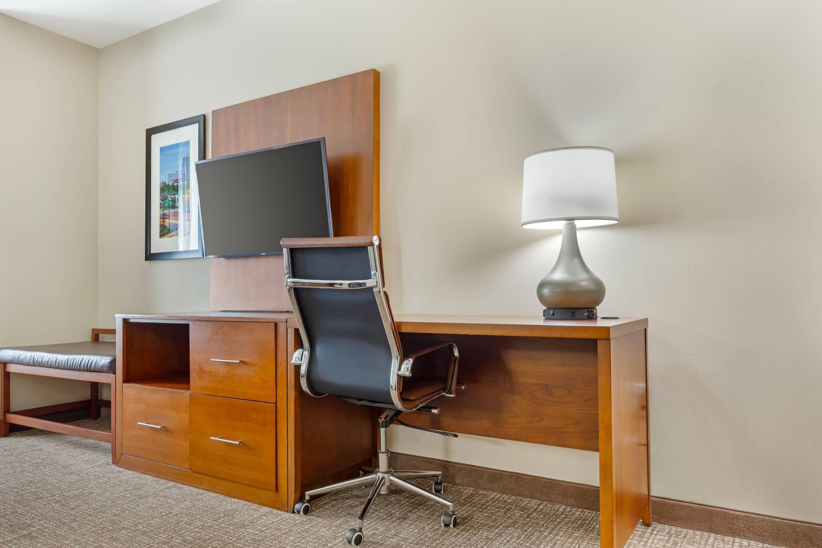 Desk, laptop workspace, blackout drapes, iron/ironing board