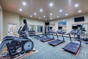 A gym with treadmills, elliptical machines, and weight equipment. - Holiday Inn Amarillo East (Amarillo)