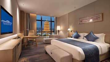 Premium bedding, down comforters, memory foam beds, minibar