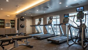 A gym with treadmills, weight machines, and exercise balls. - Residence Inn by Marriott Toledo West (Toledo)