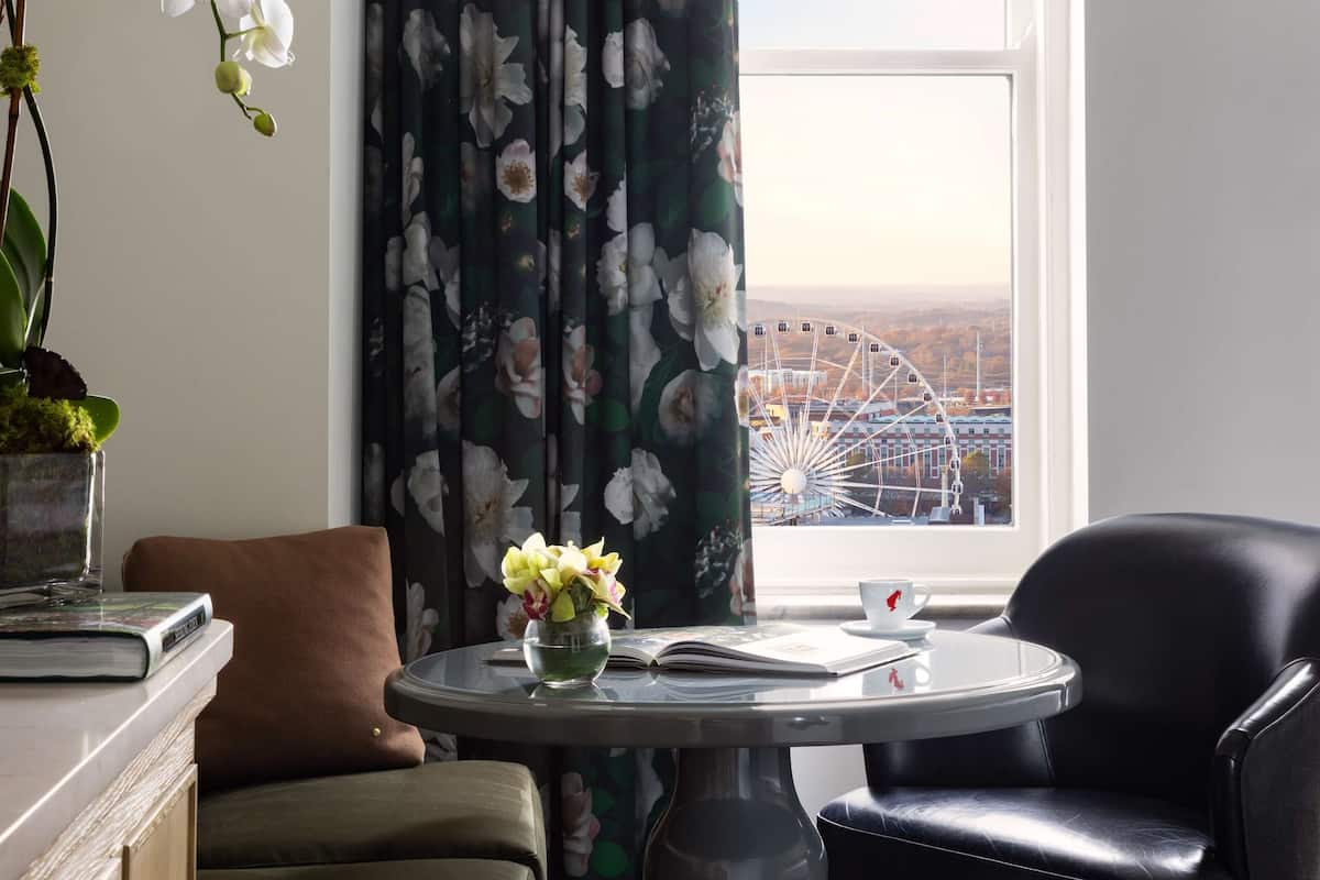 deluxe room, 1 king bed, city view | living area | 49-inch smart tv with premium tv channels, tv, mp3 dock