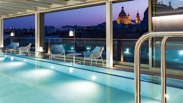 Indoor pool, open 6:00 AM to 10:00 PM, pool loungers