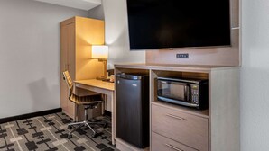 A compact hotel room with a kitchenette, a flat-screen TV, a refrigerator, and a microwave. - Sleep Inn Terre Haute University Area (Terre Haute)