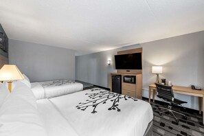 A hotel room with two beds, a desk with a chair, a television, and a microwave. - Sleep Inn Terre Haute University Area (Terre Haute)