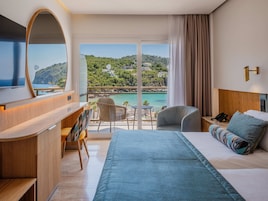 Minibar, desk, laptop workspace, iron/ironing board