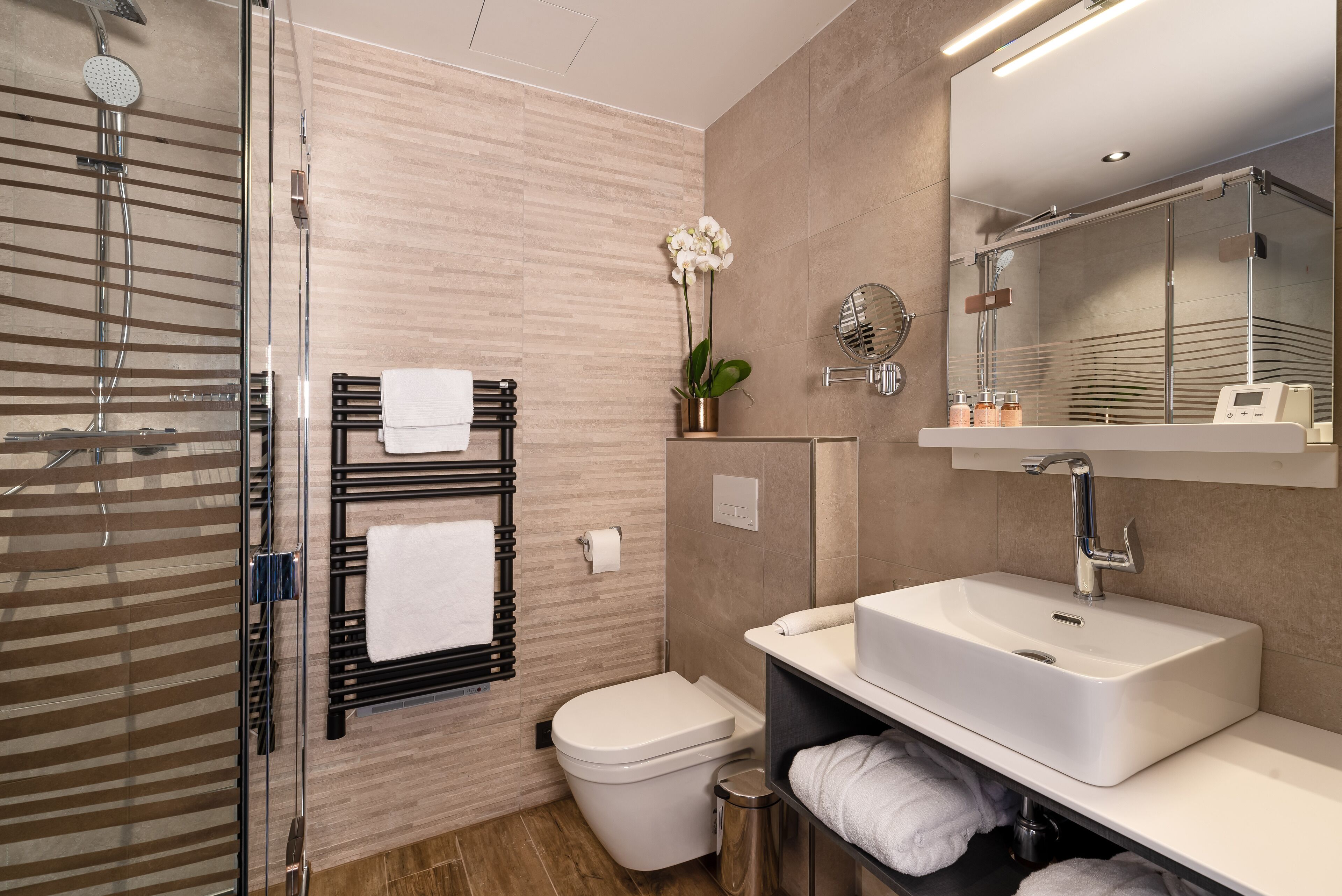 rainfall showerhead, designer toiletries, hair dryer, towels