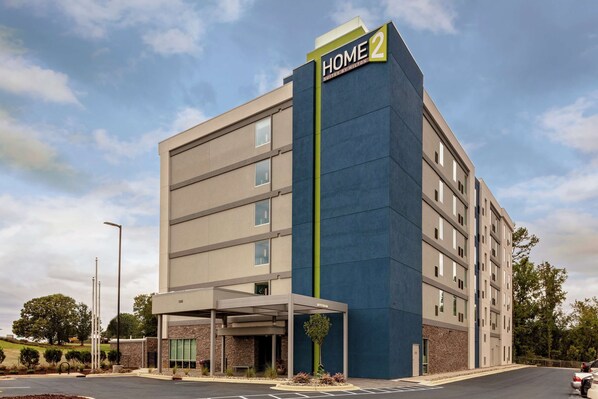 A multi-story hotel with a prominent 'HOME 2' sign, a covered entrance, and a parking lot. - Home2 Suites by Hilton Salisbury (Salisbury)