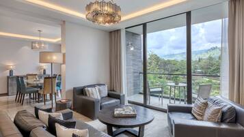 65-inch flat-screen TV with satellite channels, TV