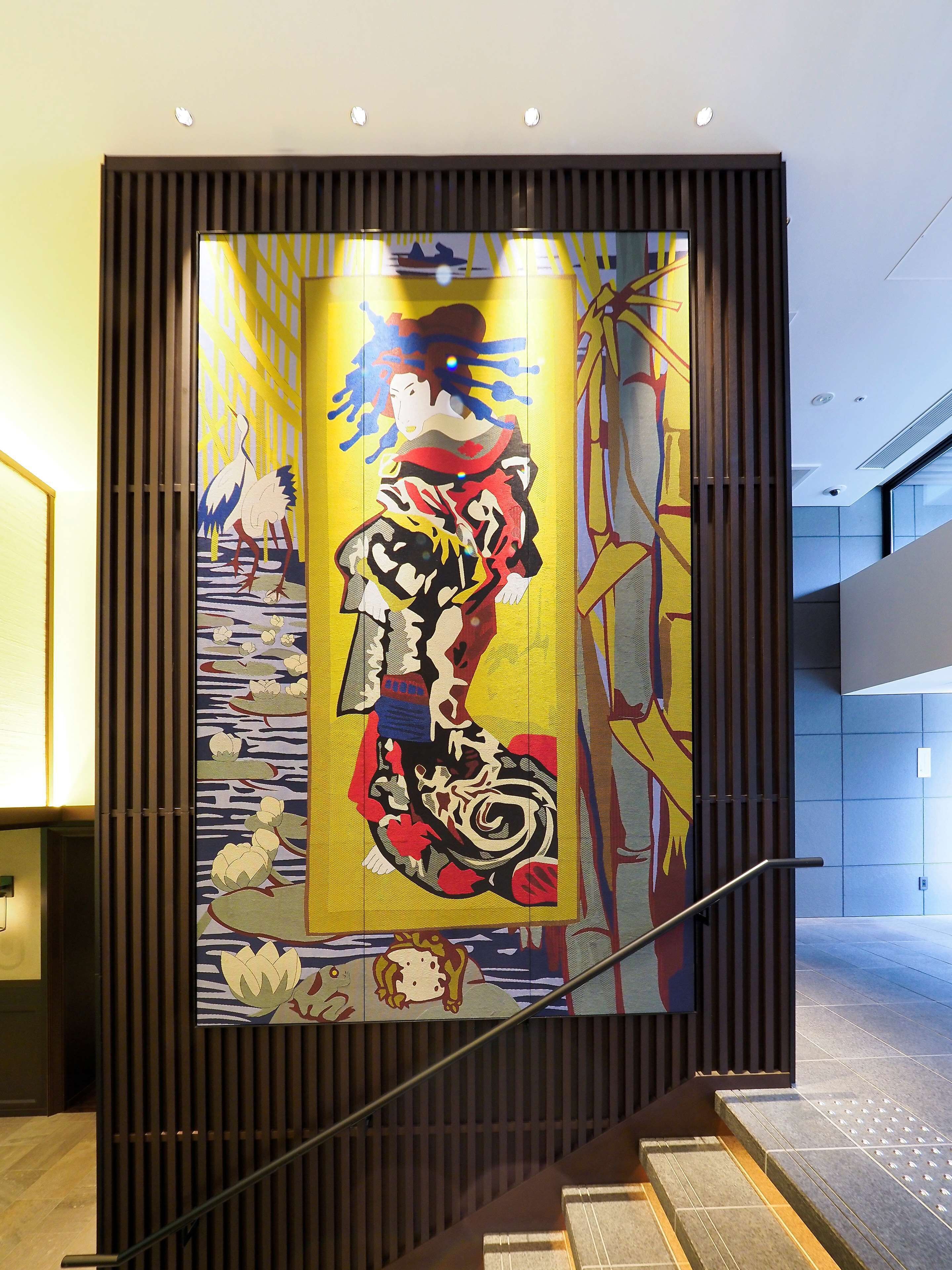 A modern interior with a decorative panel featuring a traditional design.