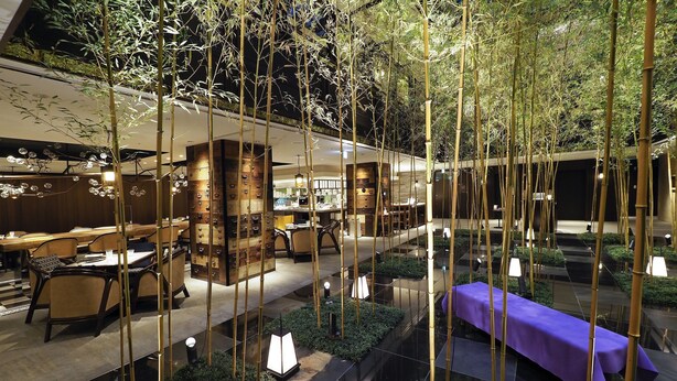A modern indoor dining area with bamboo decor, tables, and chairs. - Dhawa Yura Kyoto (Kyoto)
