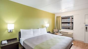 Desk, laptop workspace, blackout drapes, iron/ironing board