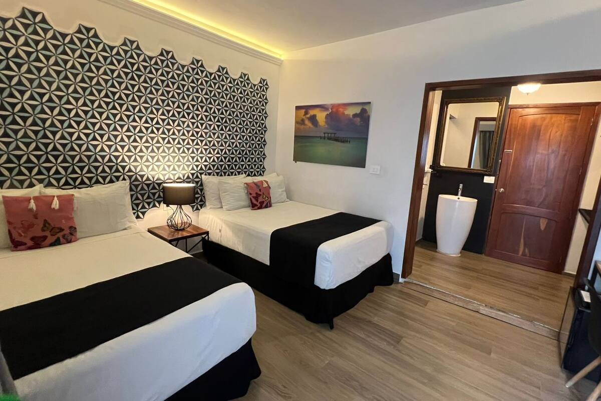 family twin room, garden view | premium bedding, down duvets, pillow-top beds, minibar