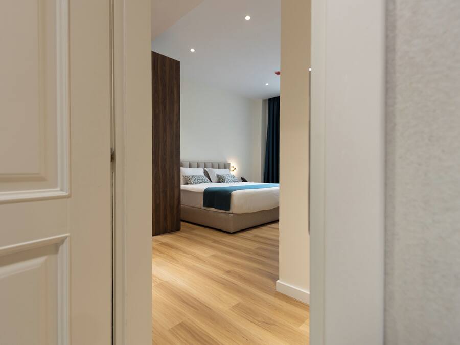 Deluxe King Suite | 1 bedroom, premium bedding, in-room safe, desk