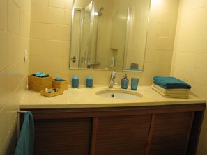 Shower, hair dryer, towels, soap