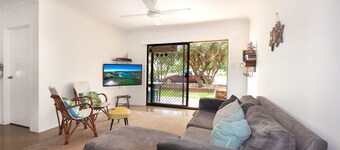 Comfortable 2BR coastal unit with WiFi, BBQ area, parking & linen included, close to beach