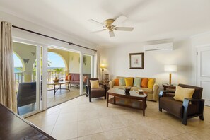 Living and dining area with smart TV and Bluetooth speaker. - Beach Front, Family-Friendly Luxury On Vibrant St. Lawrence Gap (Dover Beach)
