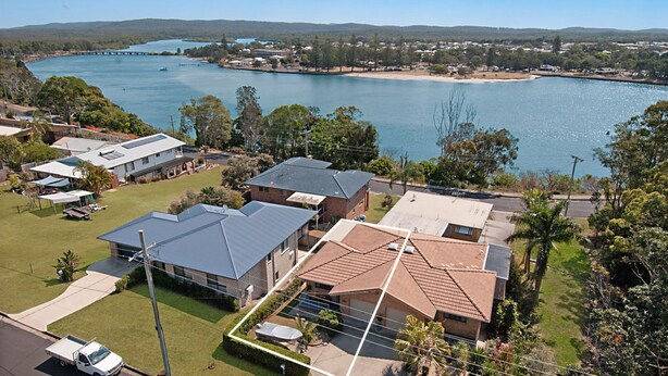 A residential area with houses, a beach, and a large body of water. - 2/36 Sunderland Street, Evans Head (Evans Head)