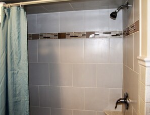 Combined shower/tub, hair dryer, towels, soap